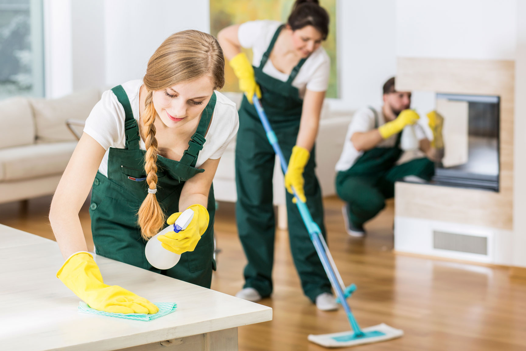 Professional Cleaners Tidying up a Big Apartment